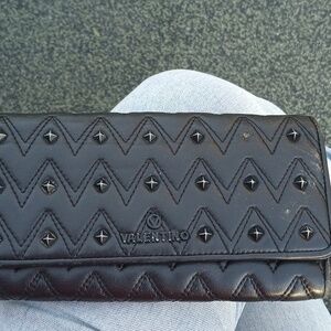 Mario Valentino Wallet black color used miss strap good condition